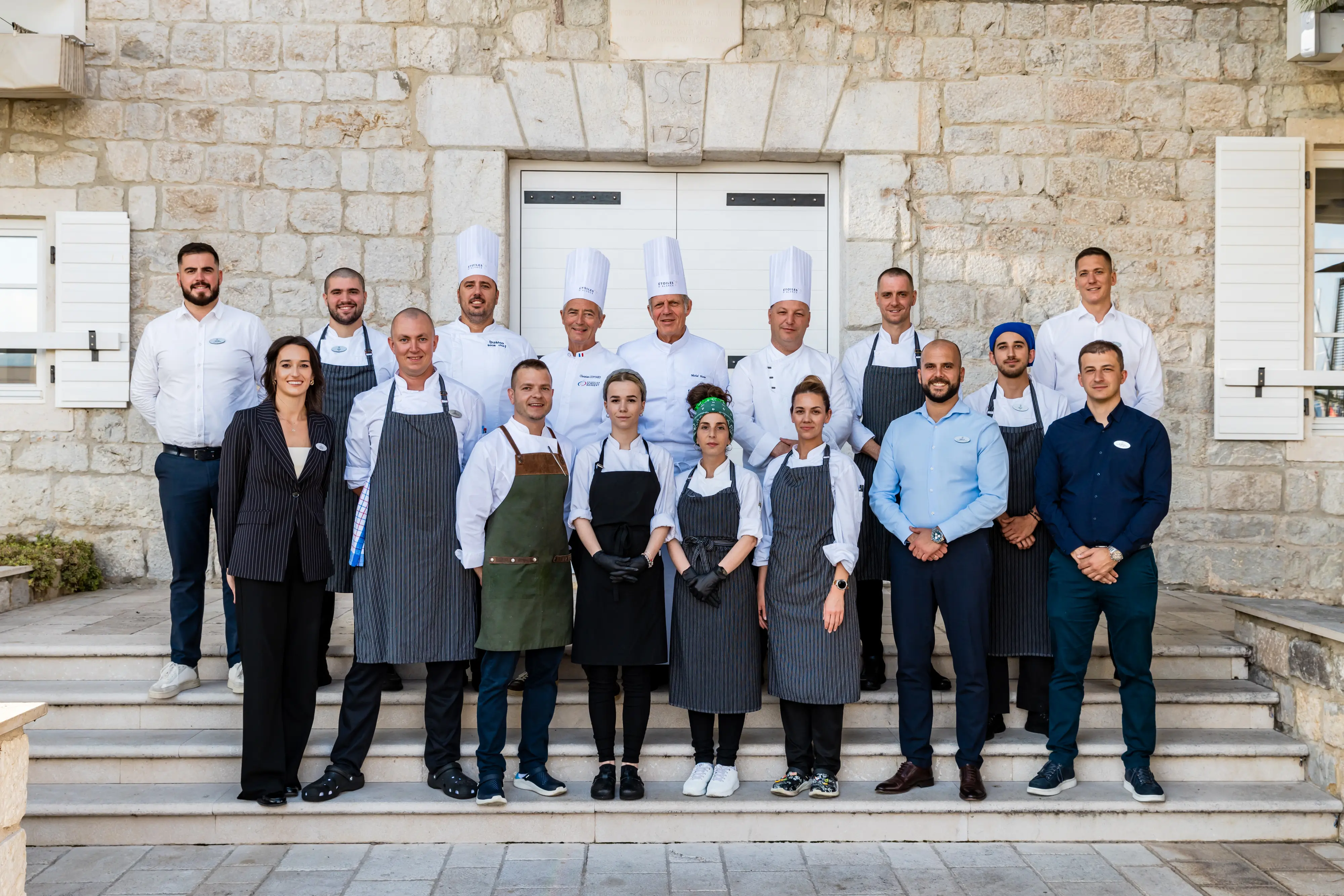 Aerial view of Budva beach with terracotta roof of houses and beach