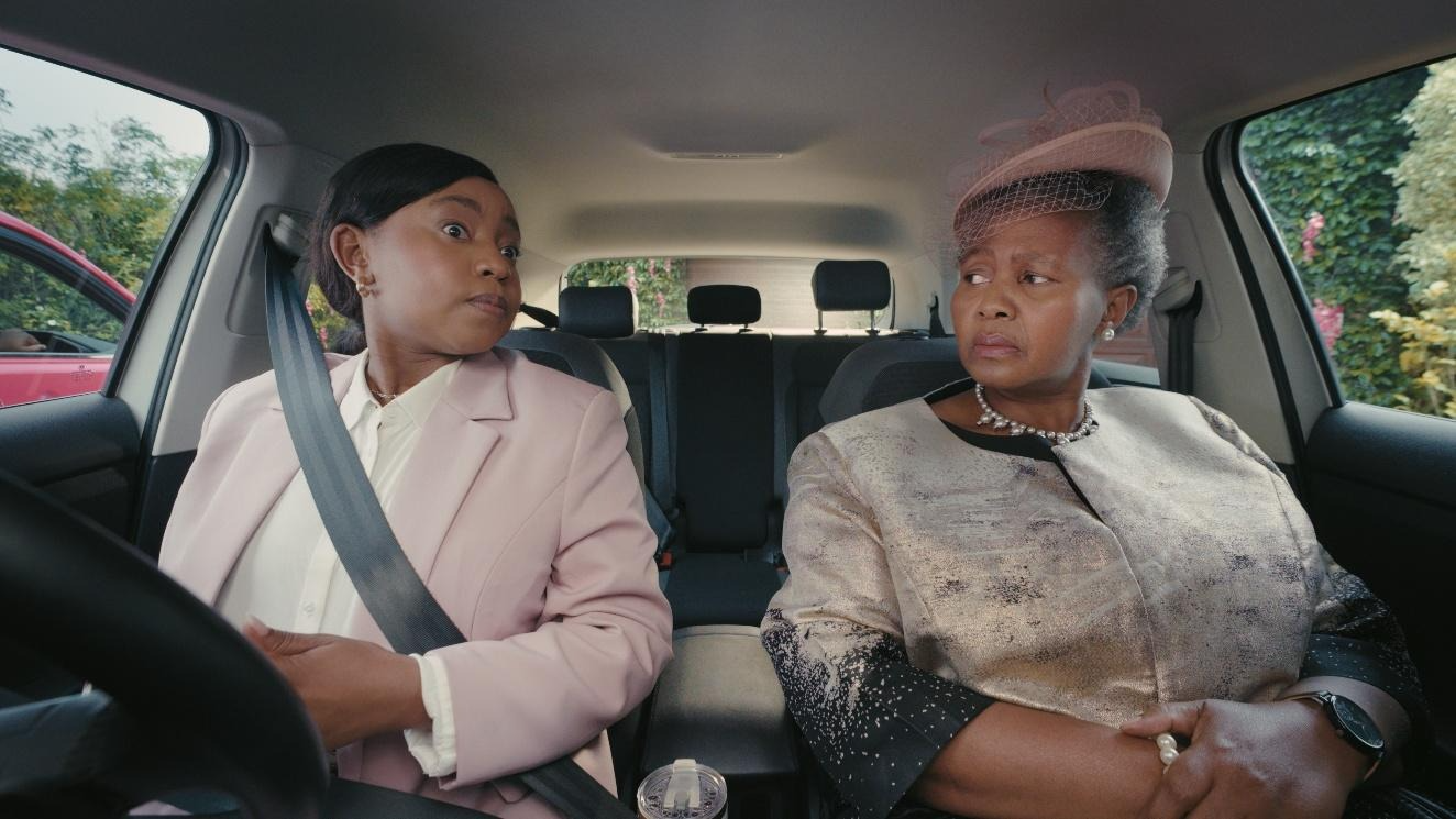 Women sitting in a car with a seat beltAI-generated content may be incorrect.