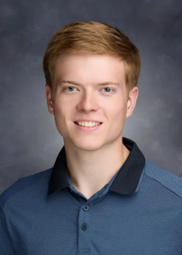 Headshot of Samuel Robertson.