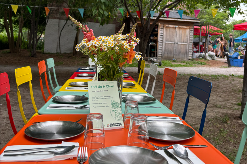Guests sharing a communal harvest lunch at a Toronto farmers' market