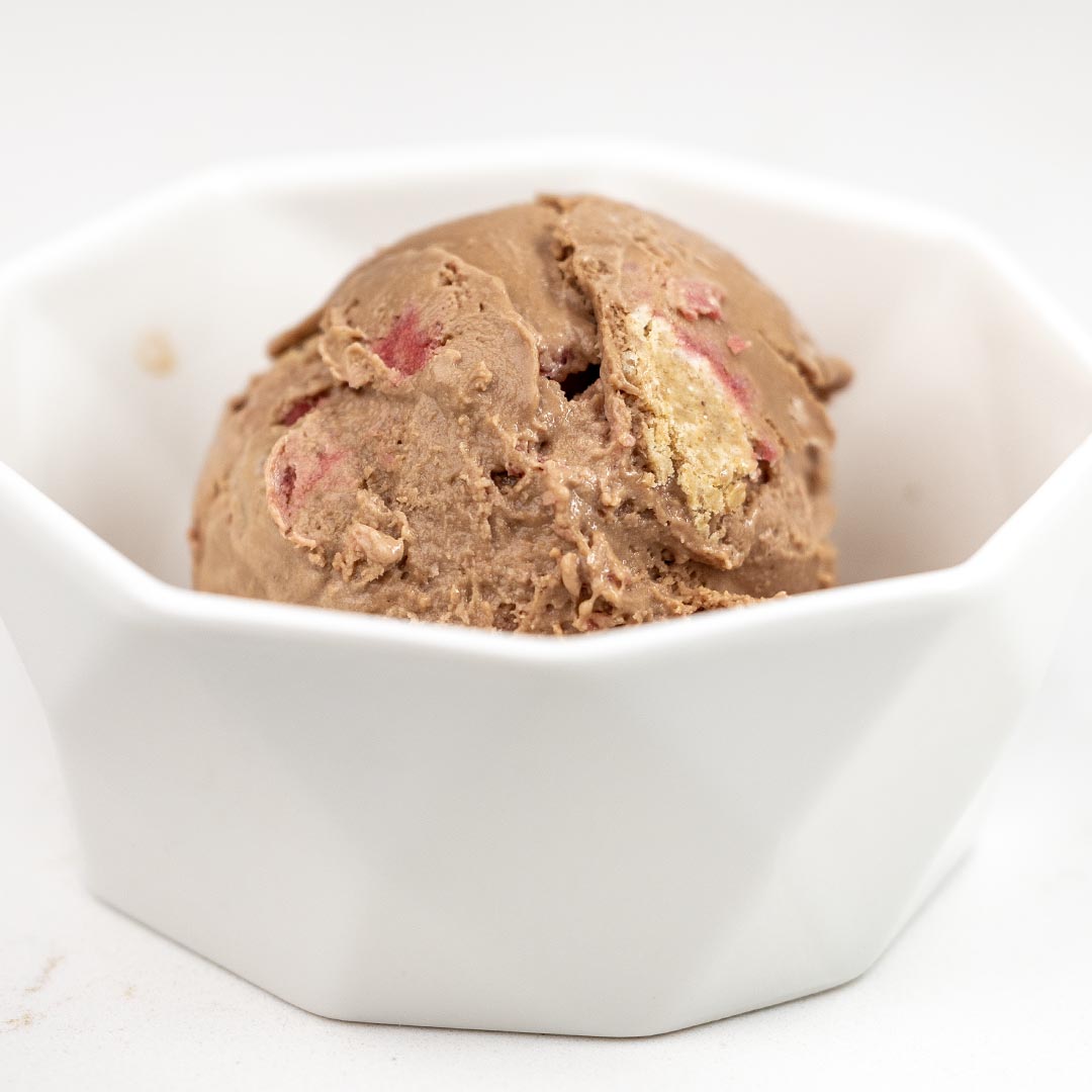 Chocolate Graham Cracker Raspberry Ice Cream combines rich chocolate ice cream, sweet-tart raspberry, and buttery graham cracker for an irresistible scoop.