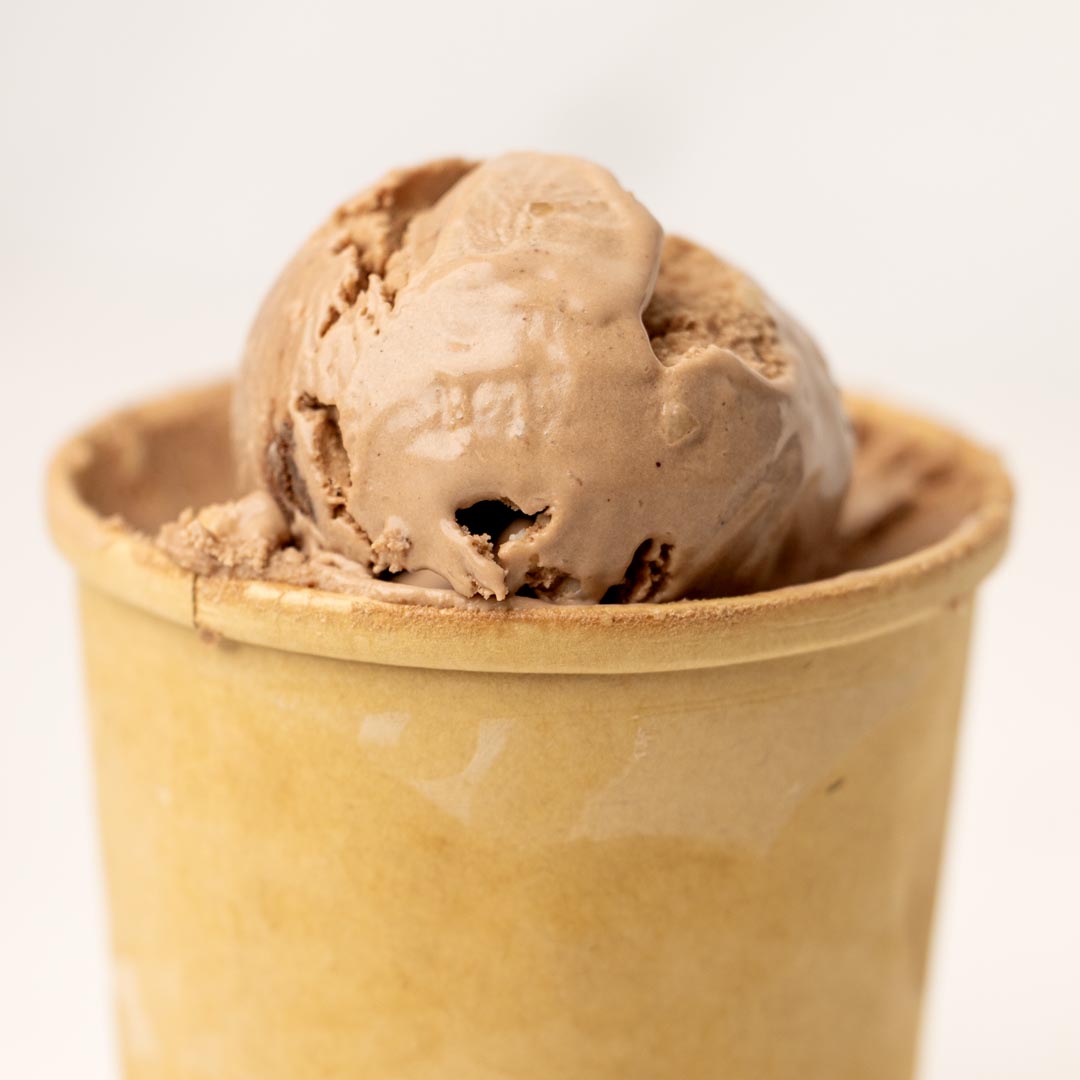 Chocolate Macadamia Nut Ice Cream combines rich, creamy chocolate ice cream with buttery macadamia nuts for a smooth, decadent, nutty frozen dessert.