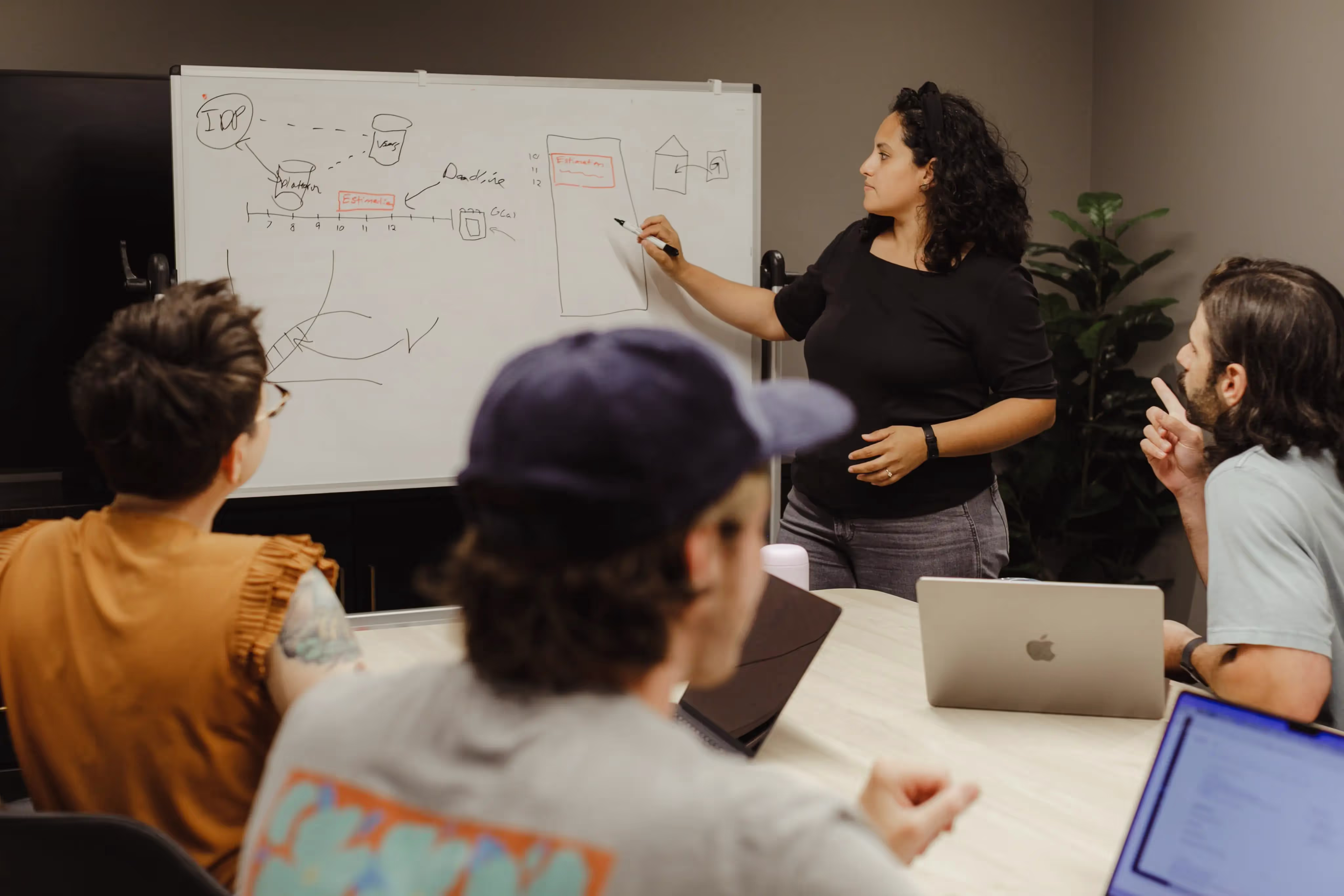 A software developer at Atomic Object whiteboarding a new software product