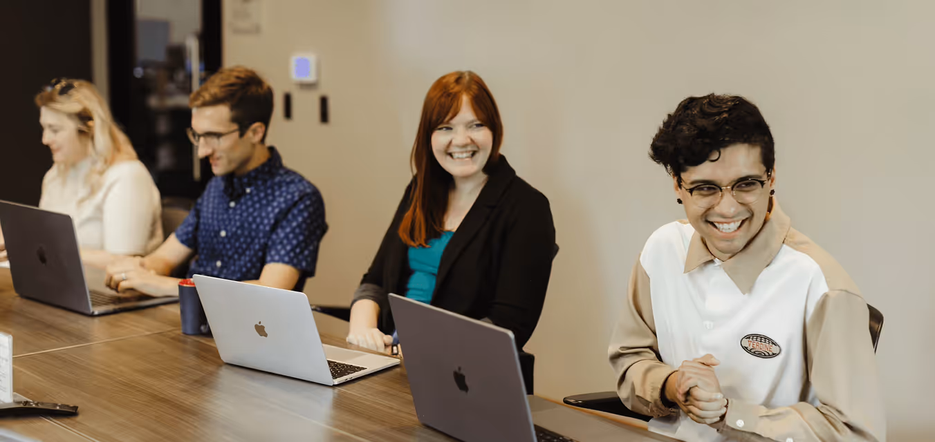 People smiling at a table