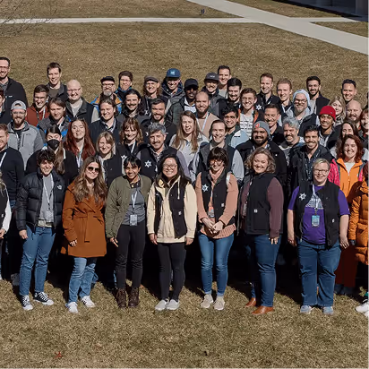 The Atomic Object team gathers outside, showcasing their diverse and collaborative culture in a group photo.