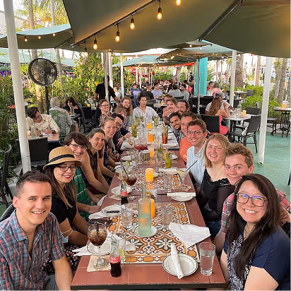 The Atomic Object team enjoys a meal together, participating in a culture of collaboration and community.