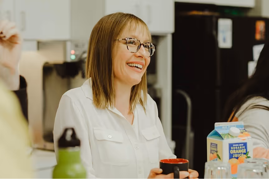 Woman smiling while seated