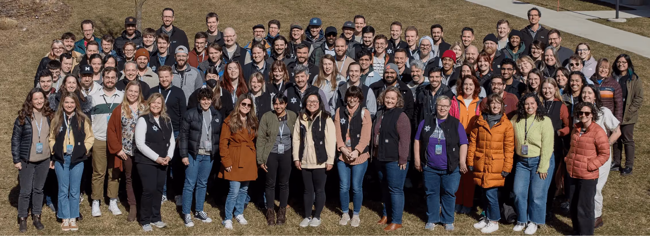 The Atomic Object team gathers outdoors to celebrate diversity and collaboration.