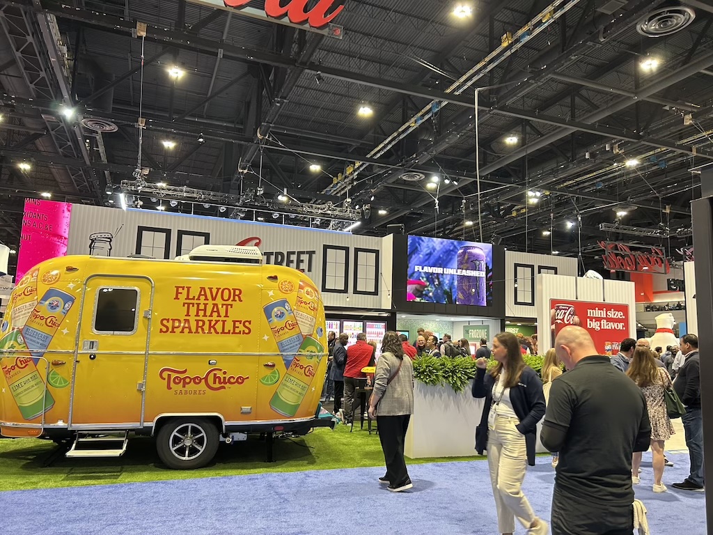 A first-time visitor's perspective at NACS Chicago, highlighting insights into the convenience store and foodservice industry, showcasing innovative store designs, engaging brand experiences, and emerging trends in product innovation.