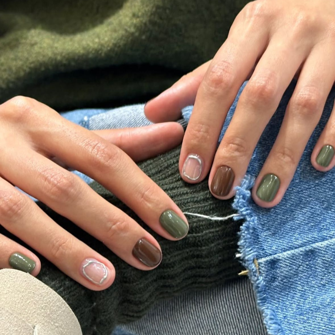 Green, brown, and silver nails.