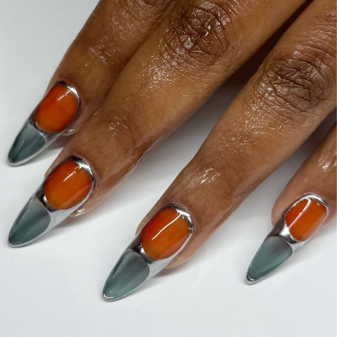 Orange and blueish gray nails with silver detailing.
