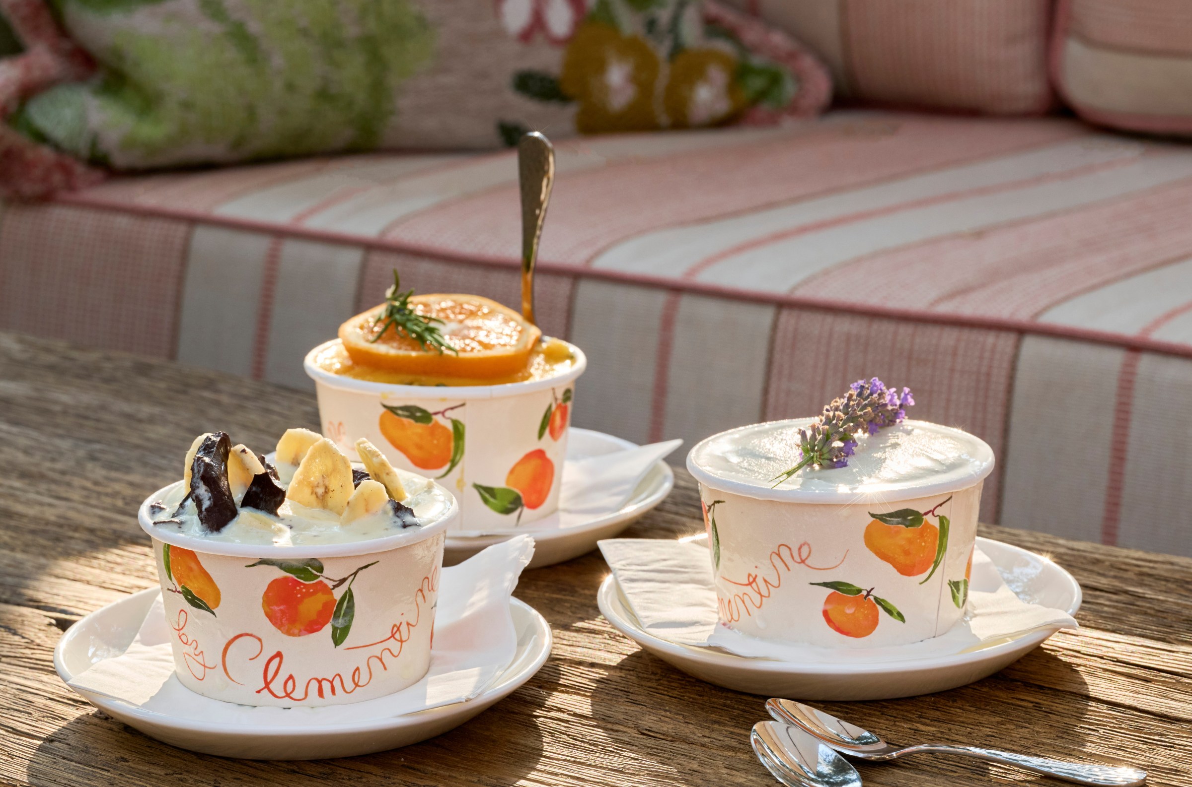 Three types of gelato in paper cups that read “Clementine,” with drawings on the side of the citrus, from the restaurant Clementine in Yountville.