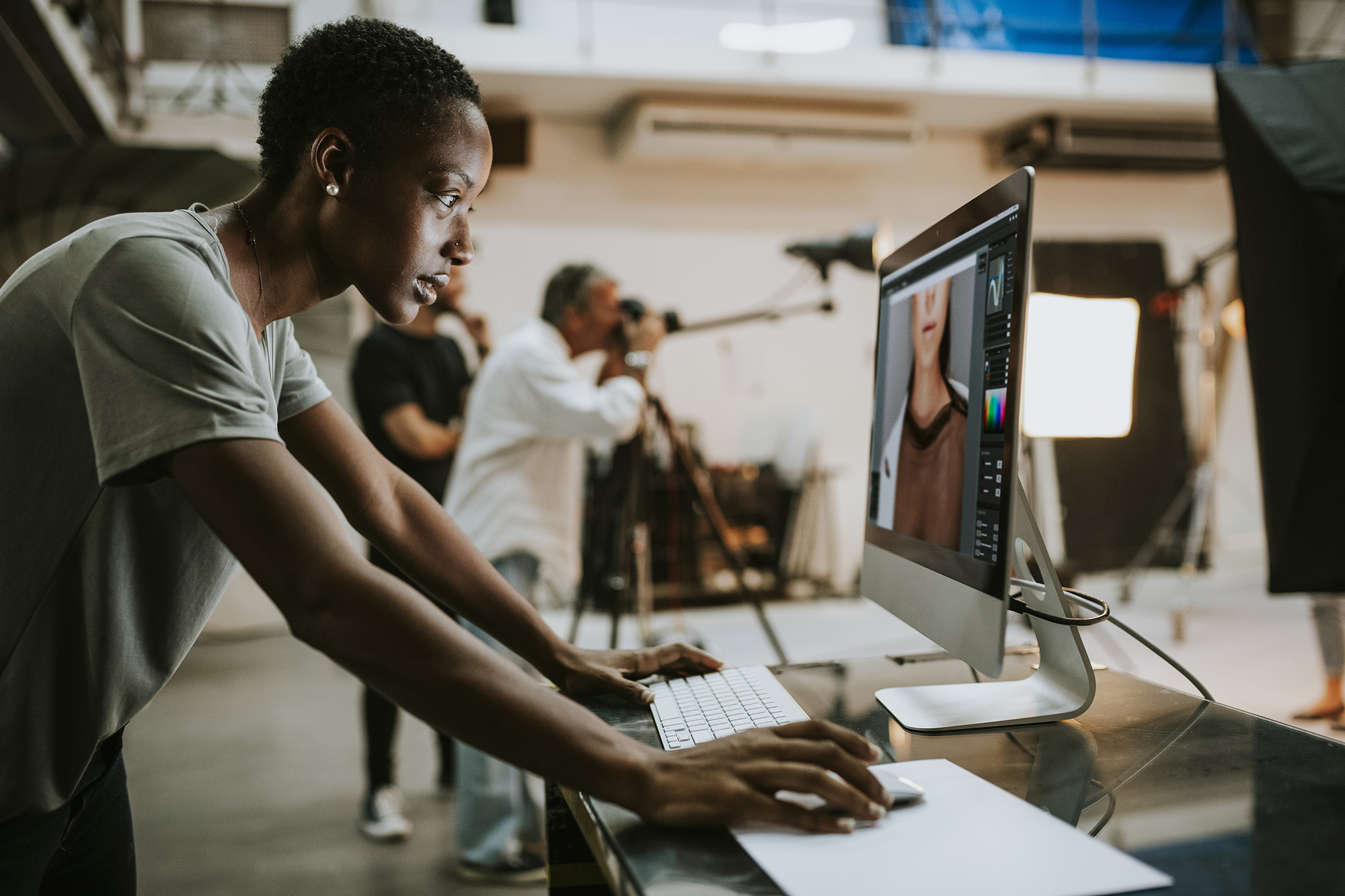 Woman at computer in creative studio