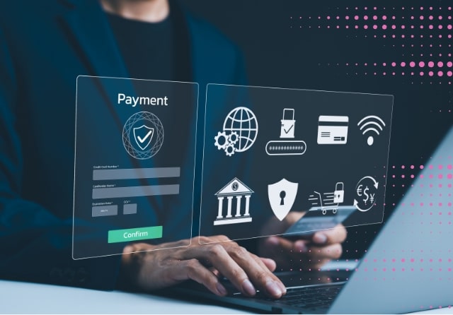 A person using a laptop to make a payment online, with transparent digital icons related to security and transactions displayed.