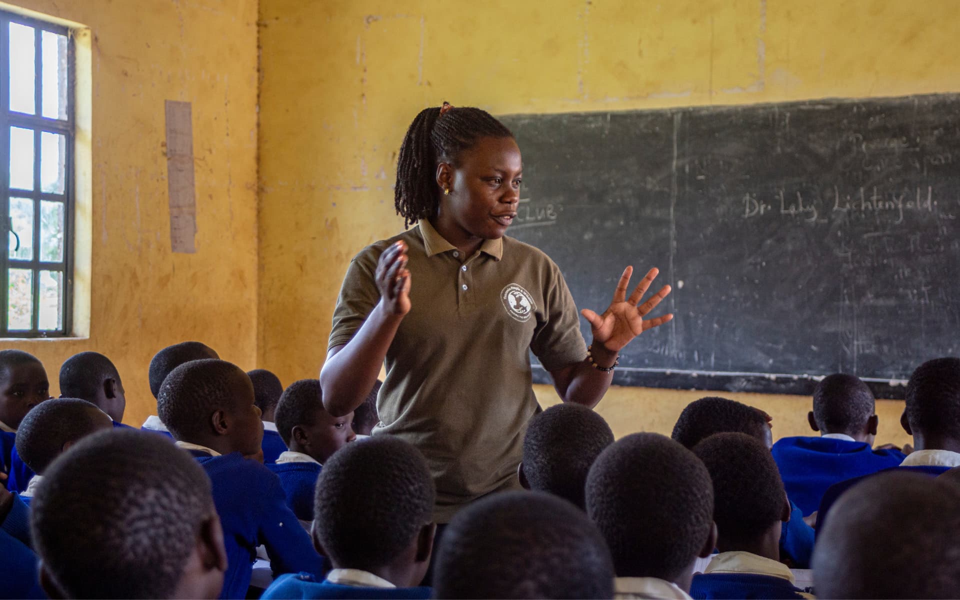 Education officers like Susan help develop youth into scholars through wildlife clubs.