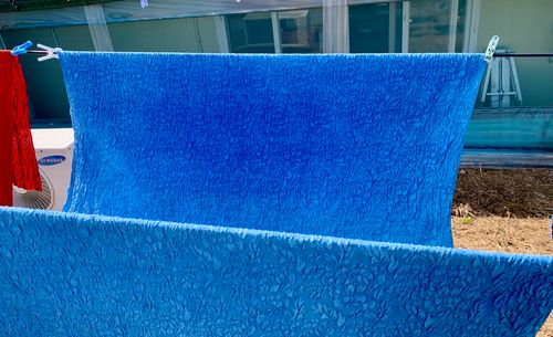 Cloths being dyed using traditional Korean natural dye technique.