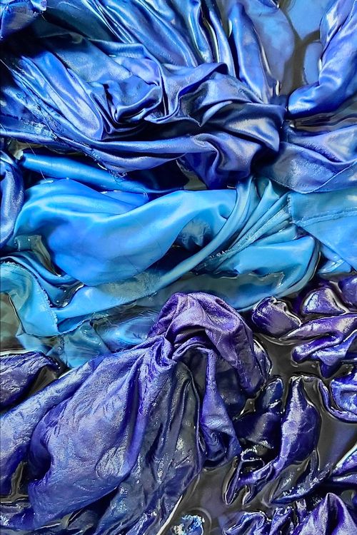 Cloths being dyed using traditional Korean natural dye technique.