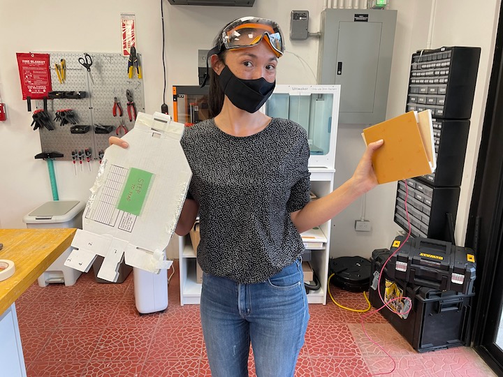 Jen holding with the materials