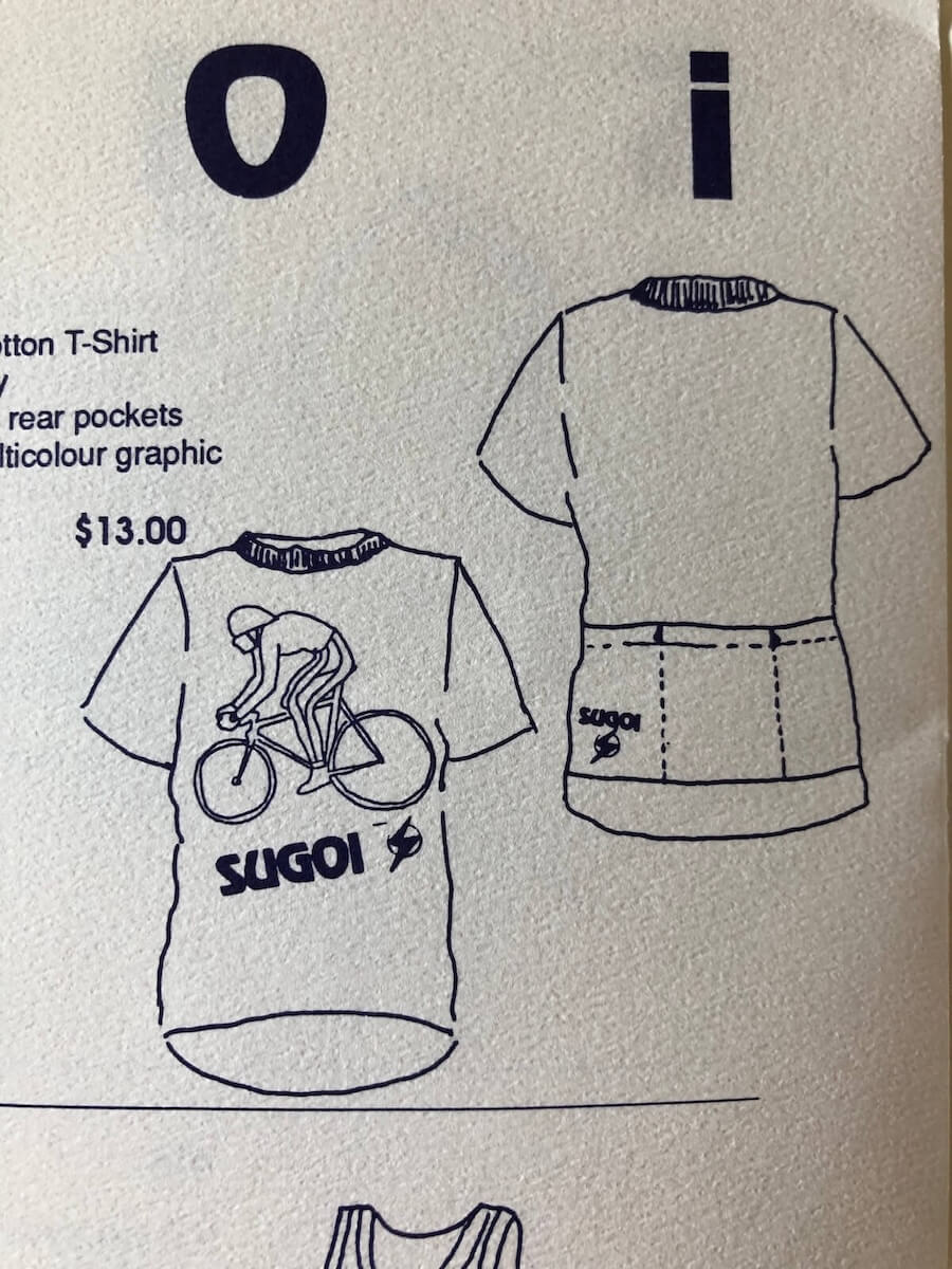 Line drawings of front and back of a short sleeve T-shirt with a cyclist graphic and SUGOI logo, priced at $13.