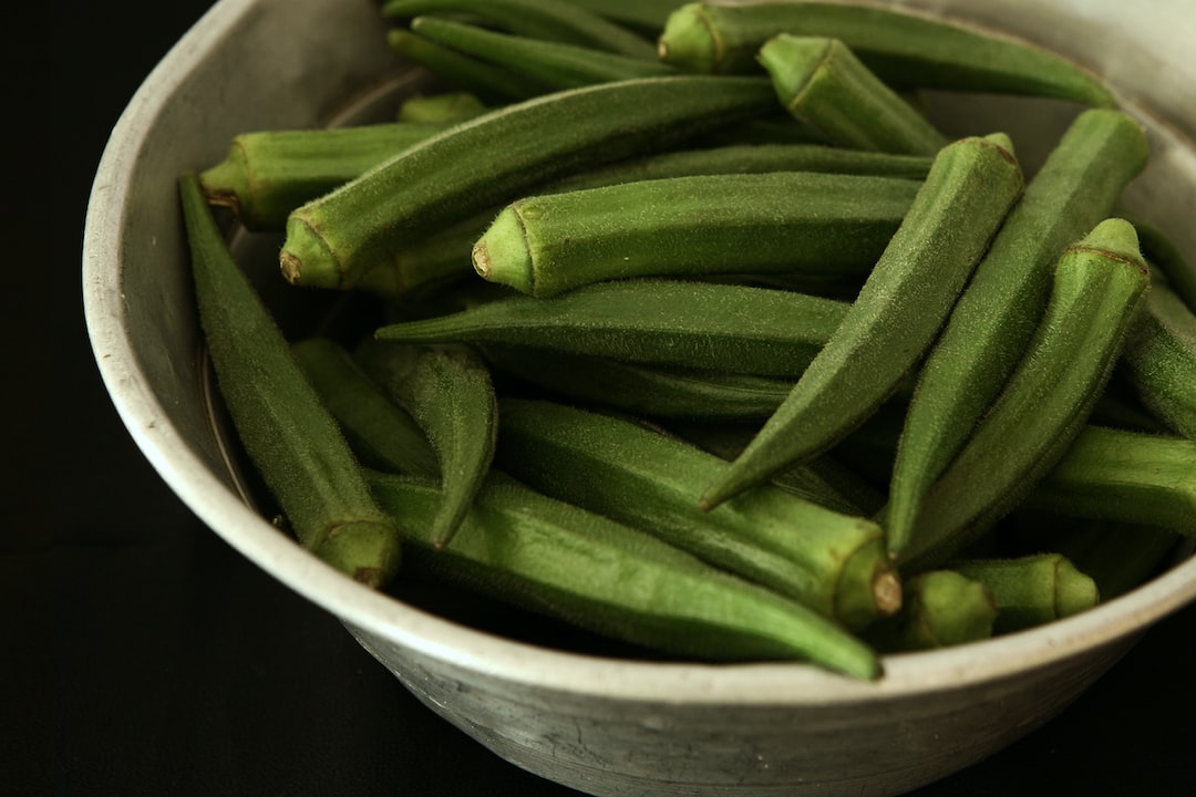 Okra plants growing in a garden.
