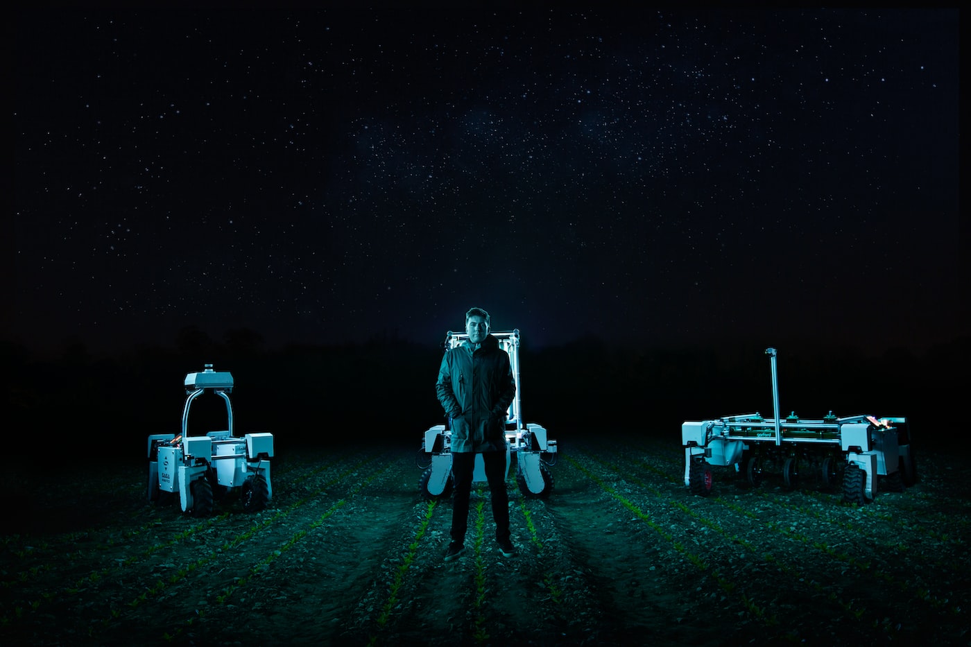 Agricultural robots working in a farm field.