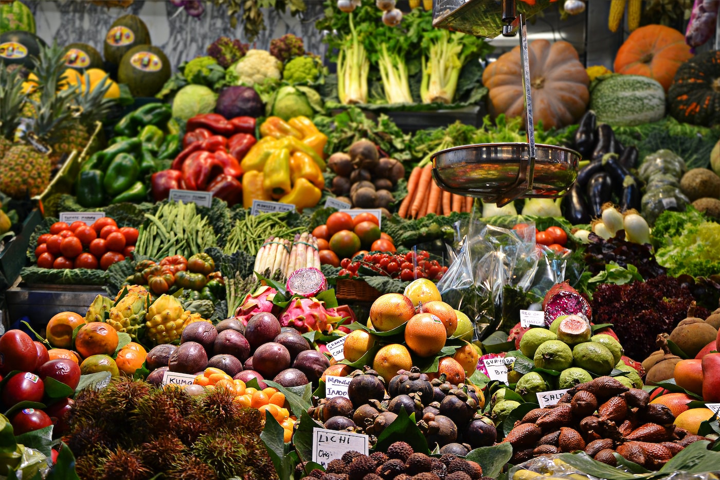 Assorted nutrient-dense vegetables including leafy greens, carrots, tomatoes, and peppers.