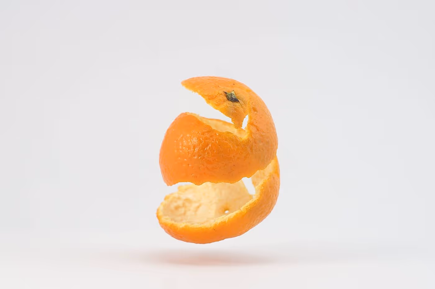 Citrus peels arranged on a surface.