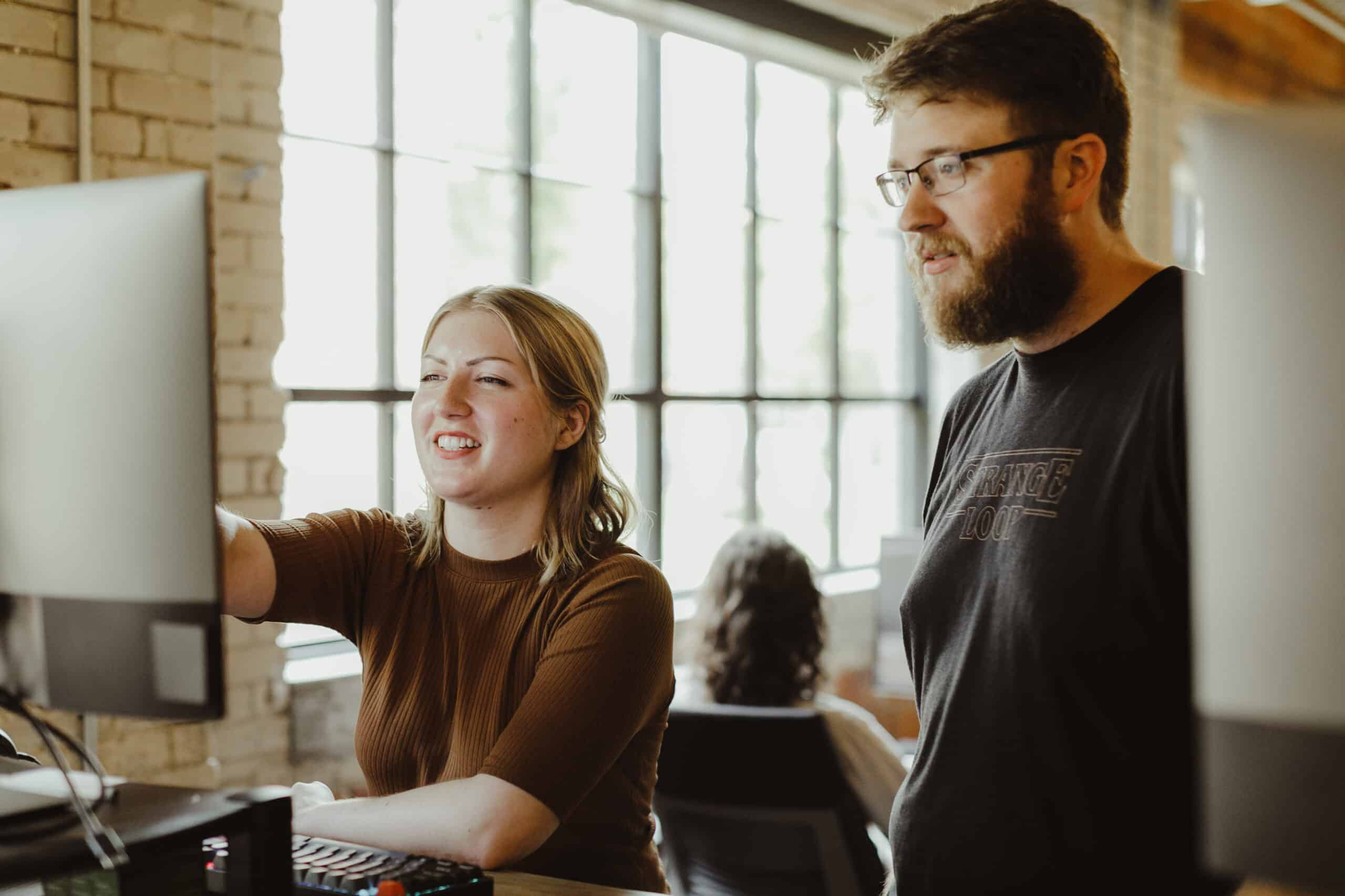 Pictured is author Lauren Ebels with a coworker. Post title: Case Study: Treating an ETL as a Software Design Problem