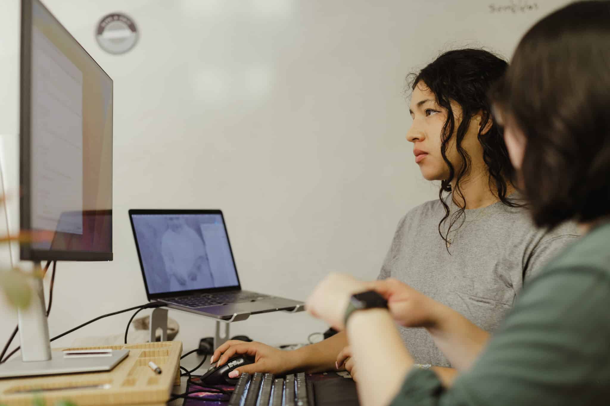 Two developers look at a monitor. Post title: How to Optimize Your Agentic-Developed Android Developer Workflow