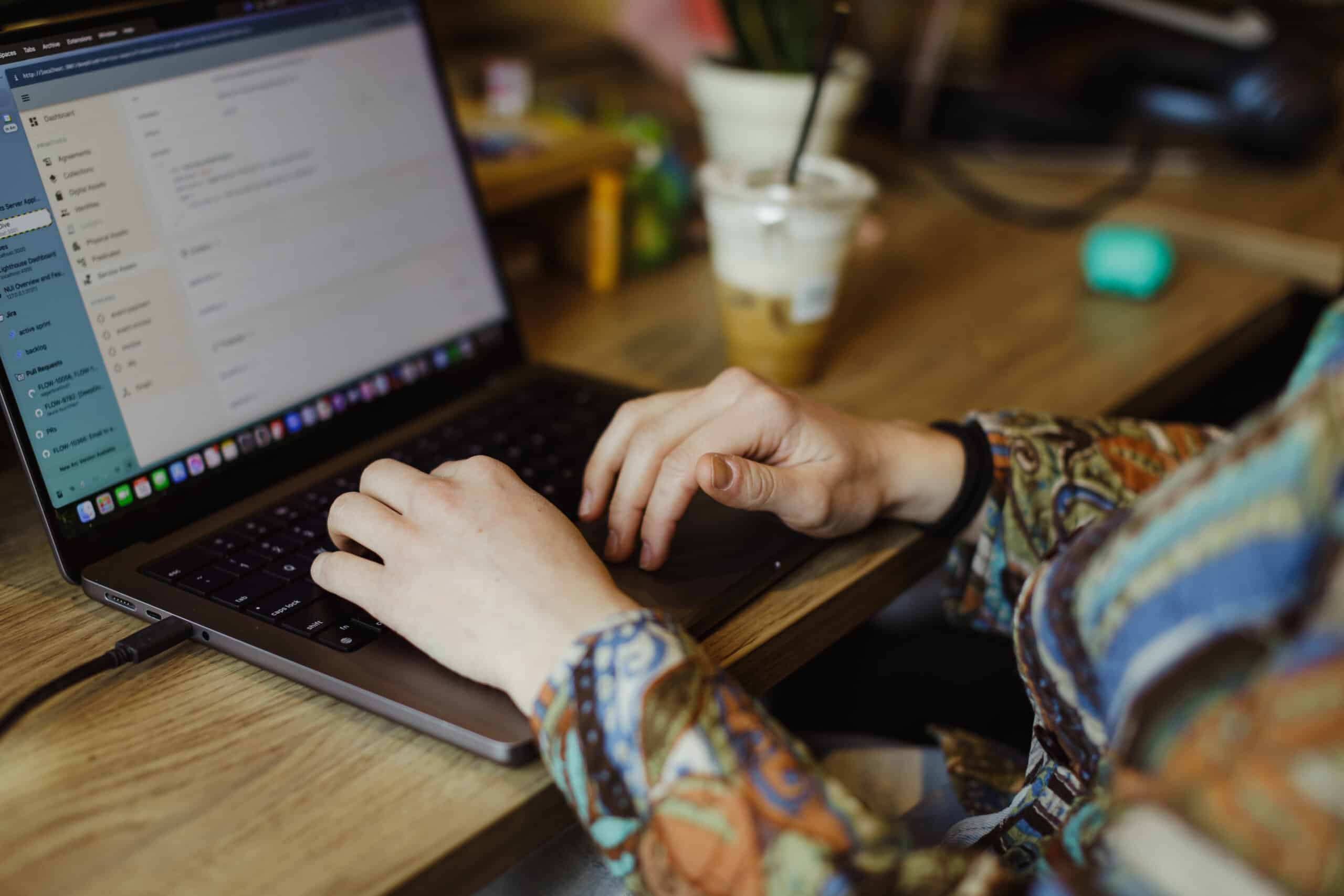 Pictured are hands on a laptop keyboard. Post title: Memgraph Query Optimization - Tips and Helpful Hints
