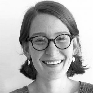 Black and white image of Anna wearing glasses