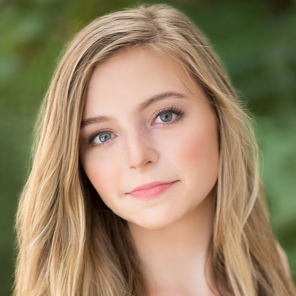 Young portland teen with blonde hair looking at the camera