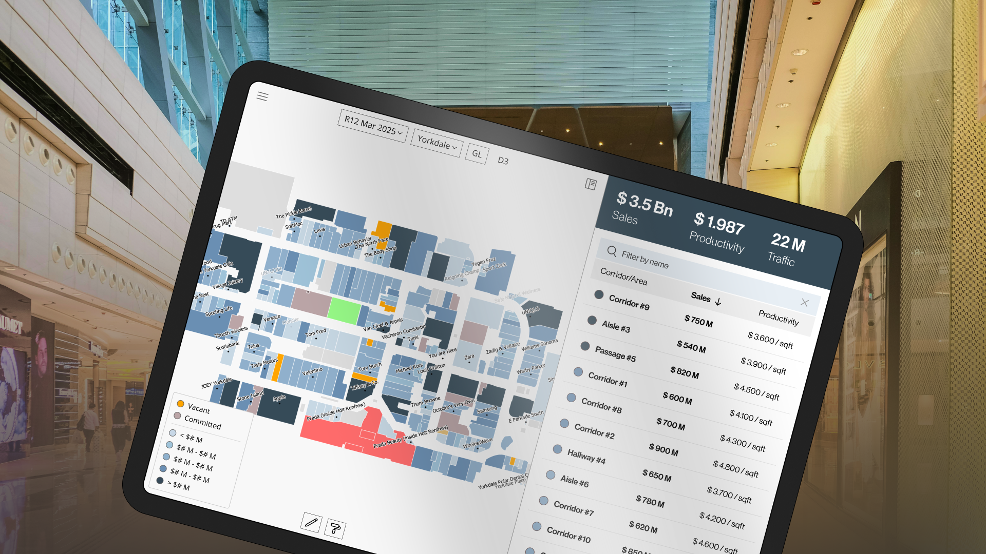 A photo of an iPad screen showing the product’s user interface, set against a blurred mall corridor backdrop.