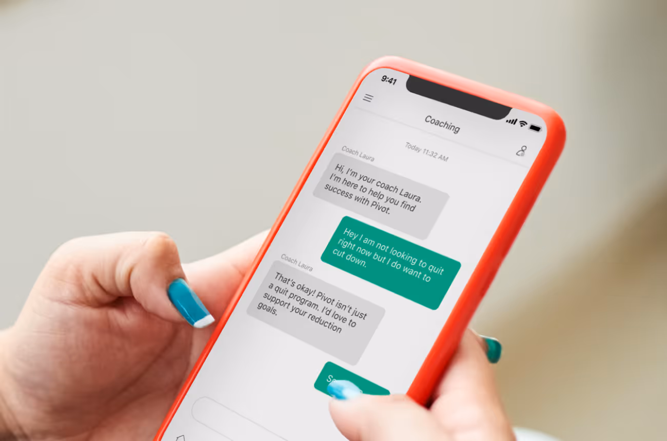 Phone with messaging app open in a woman's hands