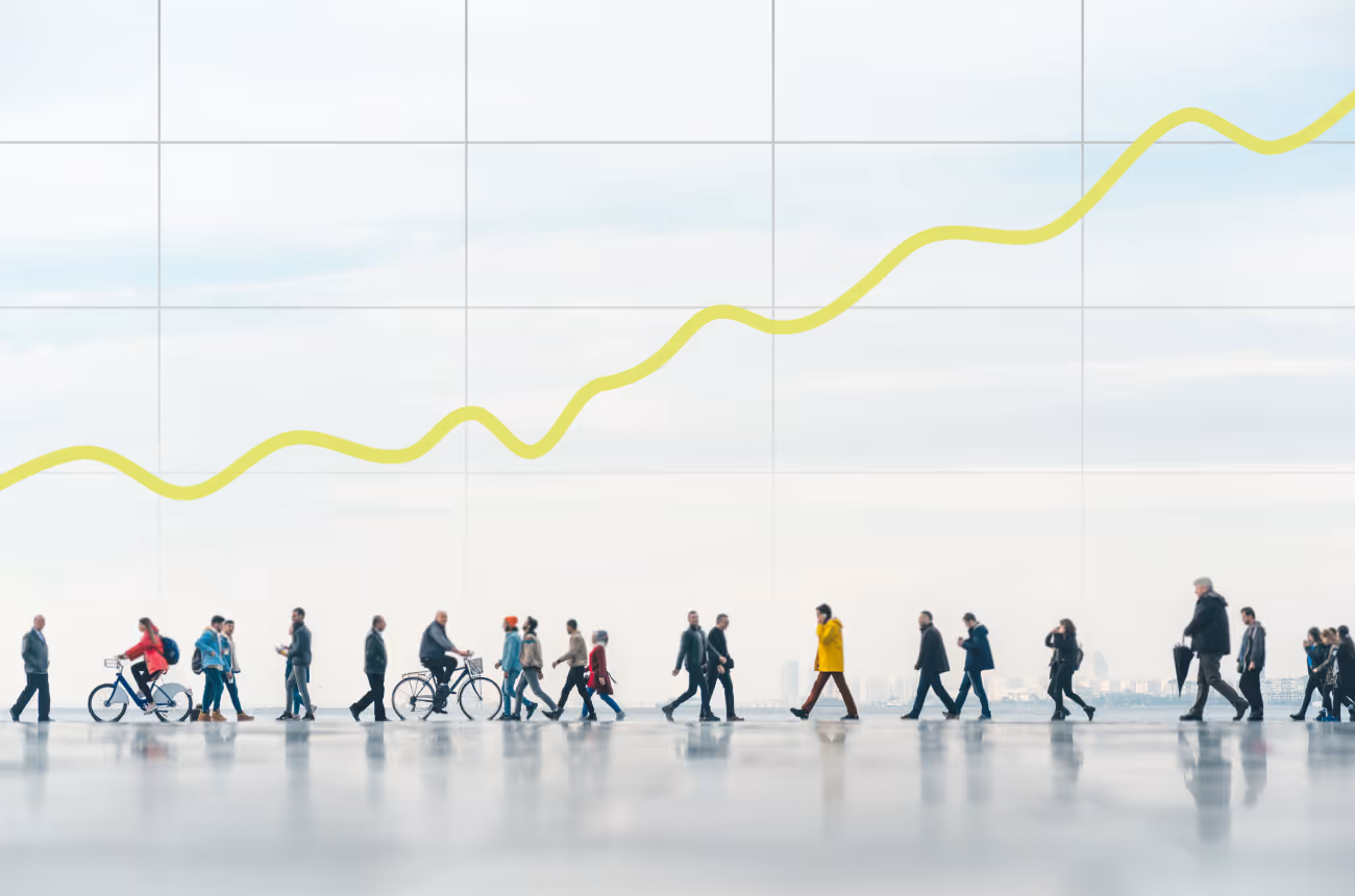 people walking in front of a graph going up and to the right