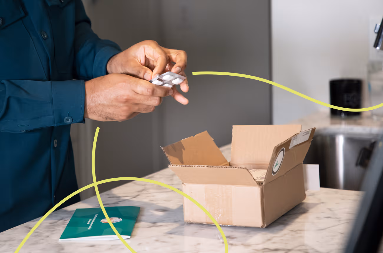 man opening up nicotine replacement therapy gum after receiving it in the mail