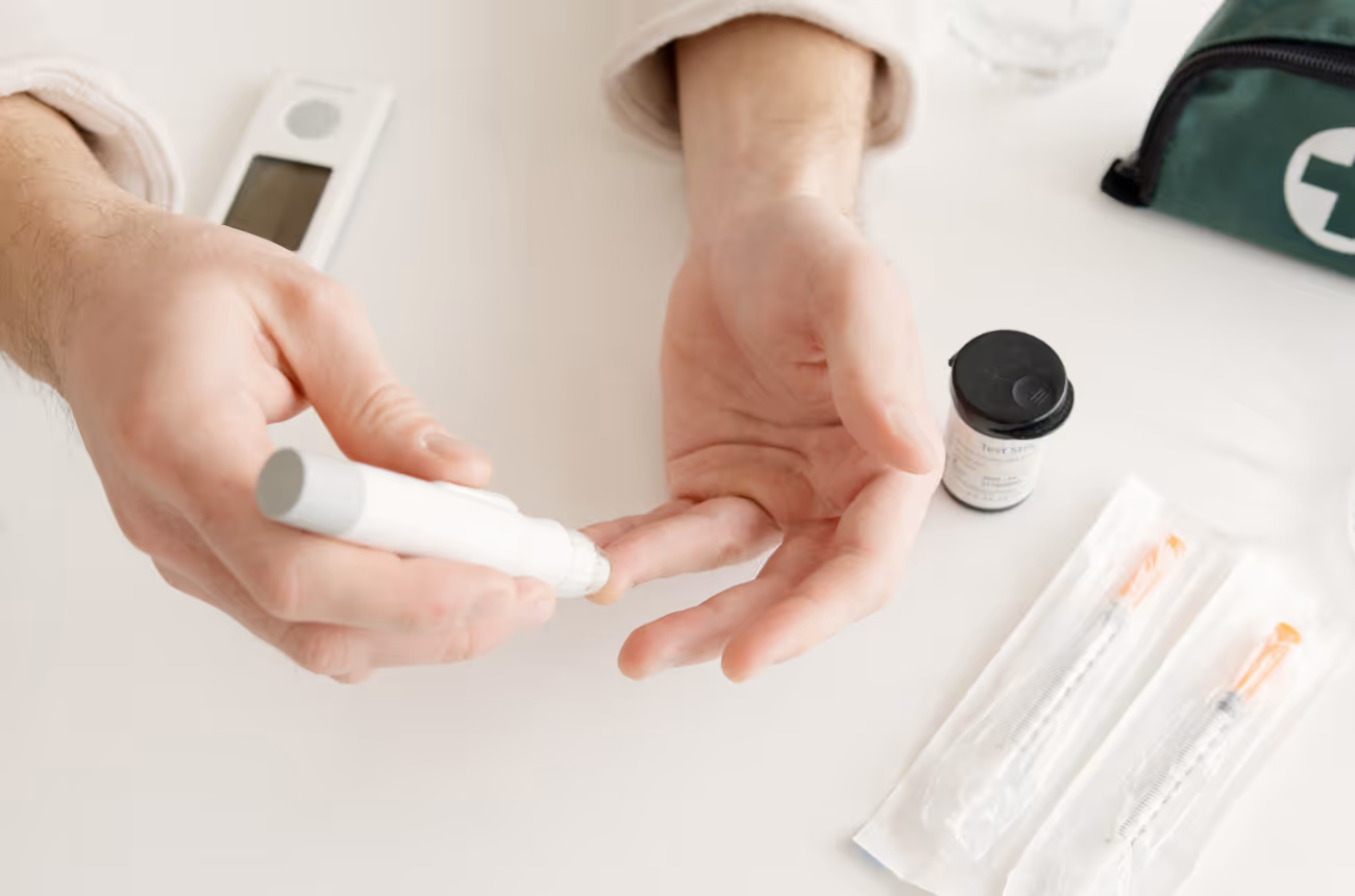 Person checking blood sugar levels with diabetic tools 