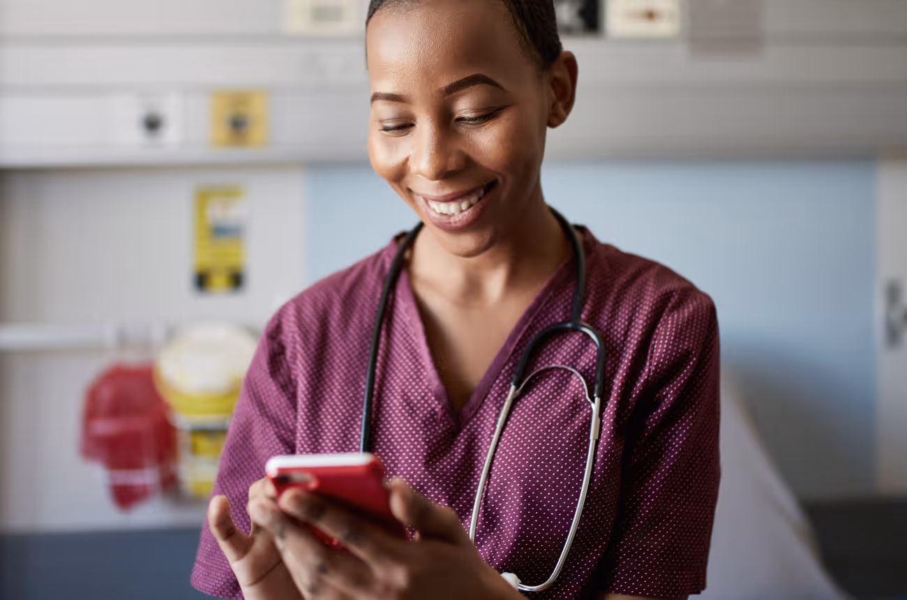 Female healthcare worker looking at phone
