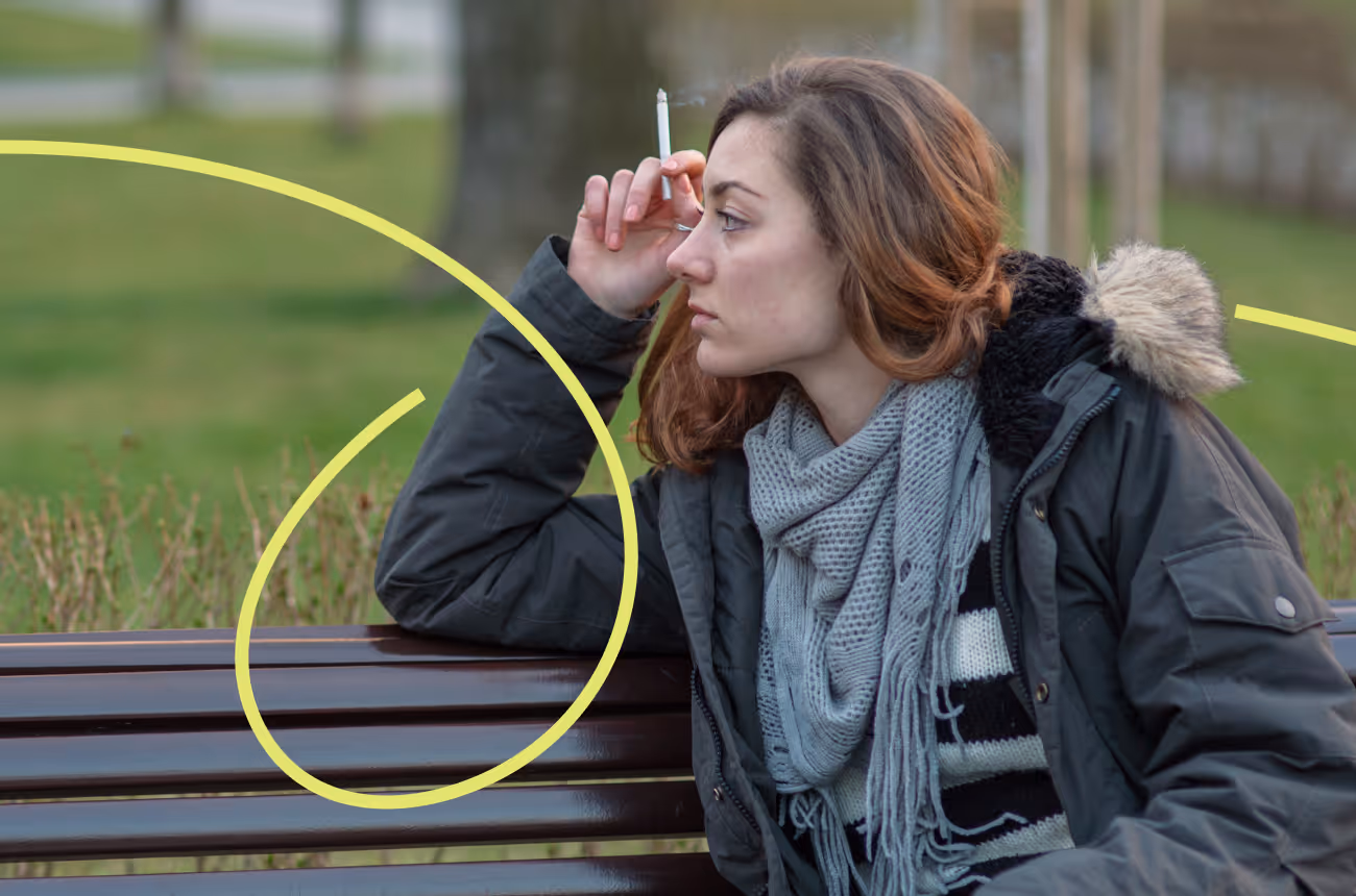Woman smoking a cigarette looking stressed with a neon squiggly line over the image