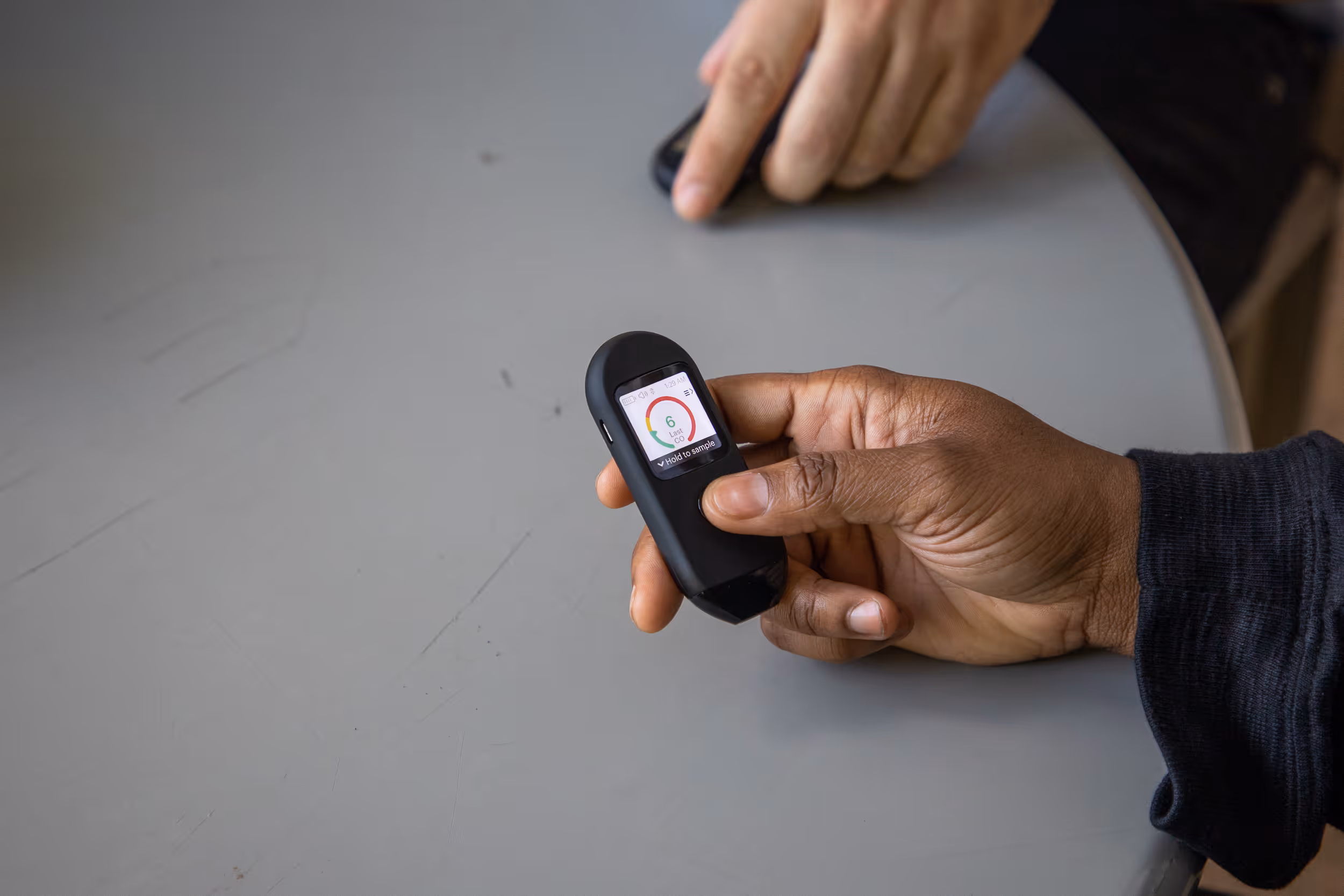 Hand holding Pivot breath sensor