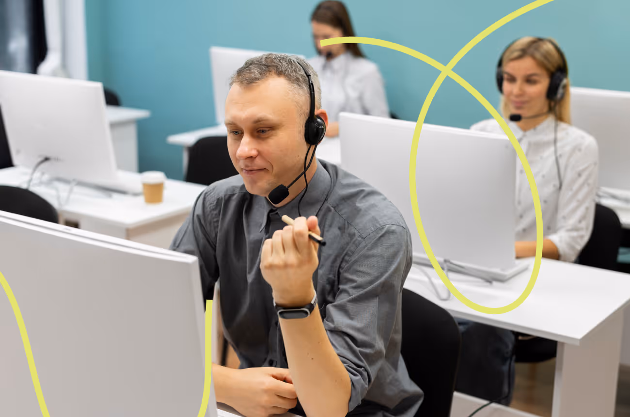 man wearing headphones and looking at computer