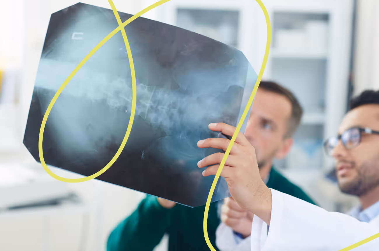 medical professionals looking at an xray