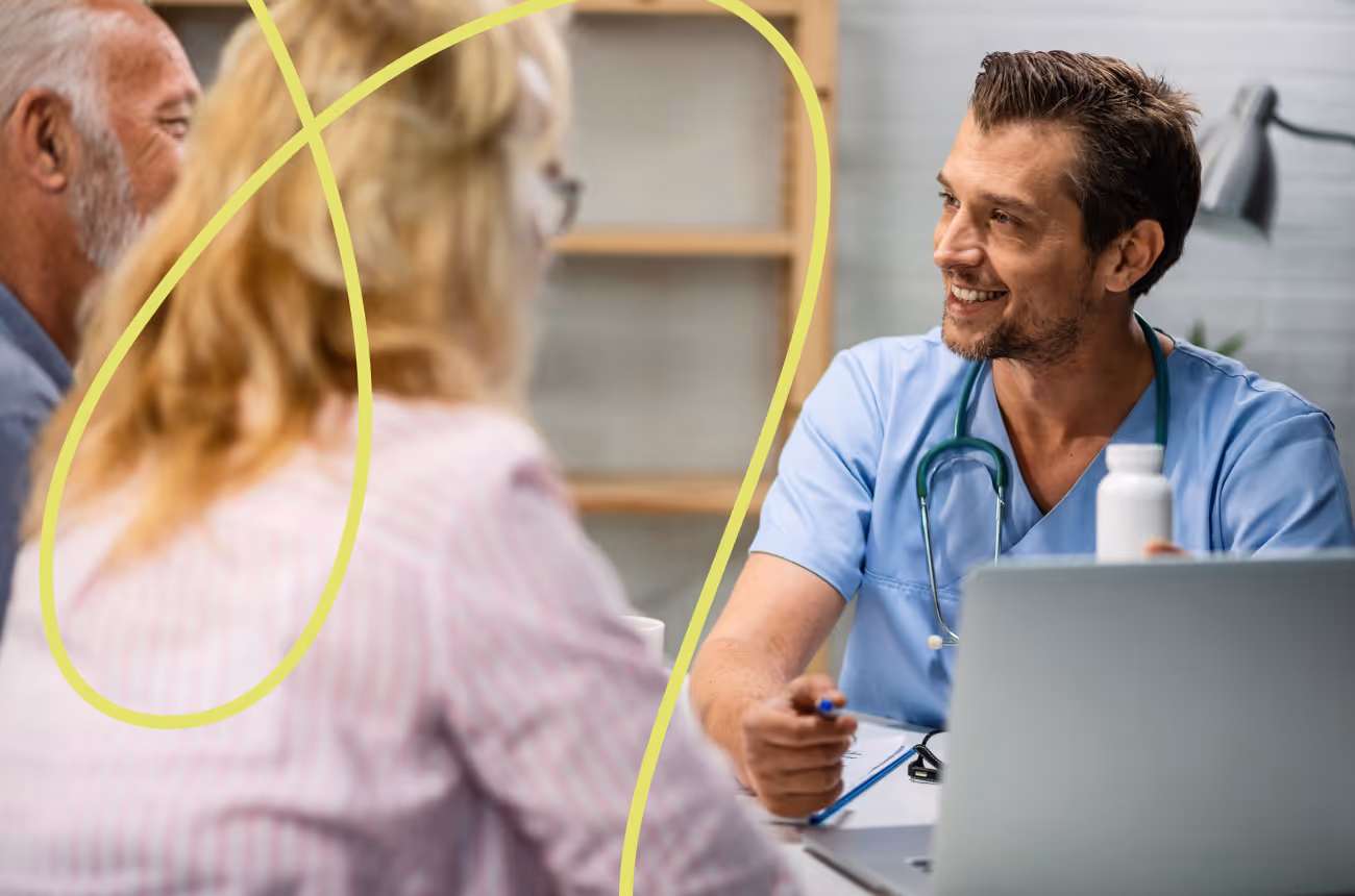 smiling doctor speaking to patients