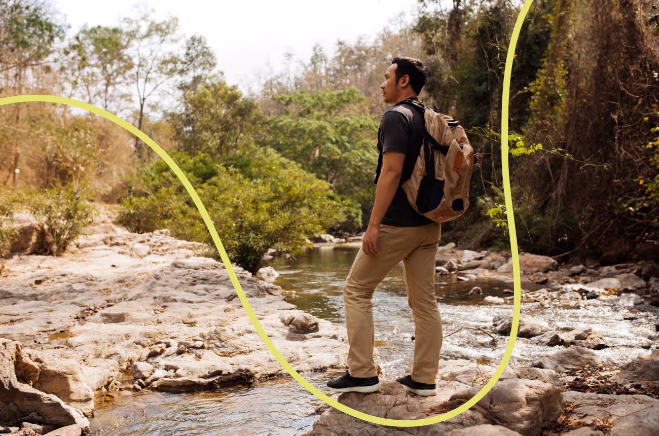 man hiking staring off into the distance