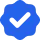 Blue checkmark symbol on a white background, within a blue hexagonal shape outline.