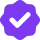 Purple verified checkmark icon on white background, symbolizing approval and confirmation in digital interfaces and design.