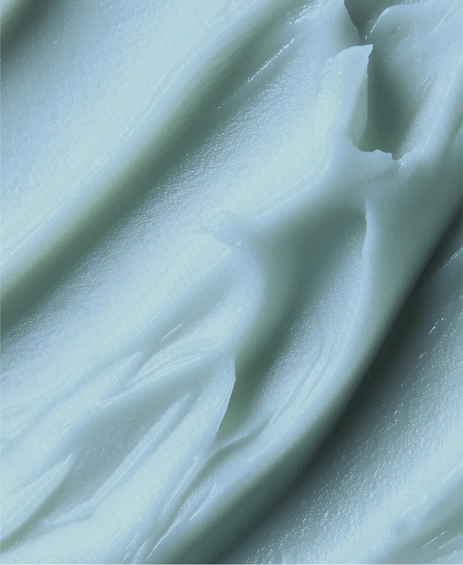 User interacting with a smartphone displaying GlossGenius’sa medical spa management software calendar interface.