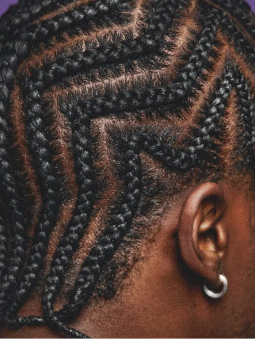 Closeup of patterned cornrows style