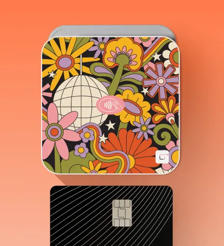 GlossGenius Tap & Go credit card reader with a retro floral design, paired with a black credit card.