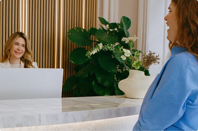 Image of a client engaging with a medspa receptionist